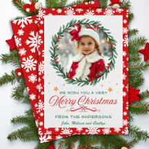 Röd och vit snöflingor med kransad julfoto