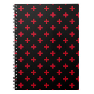 Röd polka kor på svart anteckningsbok