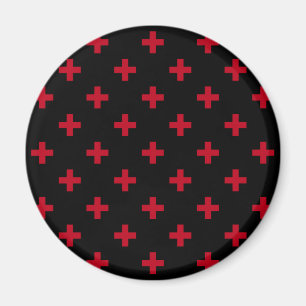 Röd polka kor på svart magnet