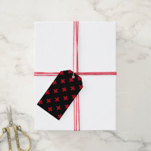Röd polka kor på svart presentetikett