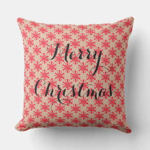 Röd prickad stjärna på taupe kudde