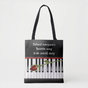 röd ros på piano tangentbord tygkasse