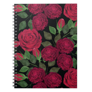 Röd ros på svart. anteckningsbok