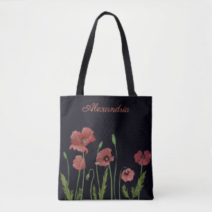 Röd vallmoblomma på svart monogram tygkasse