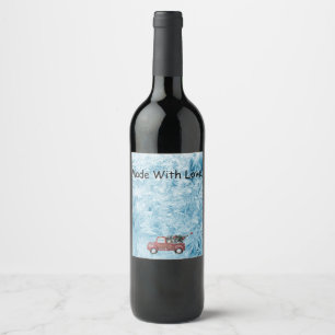 röd vintage lastbil på en blå snöflinga bakgrund vinflaska etikett