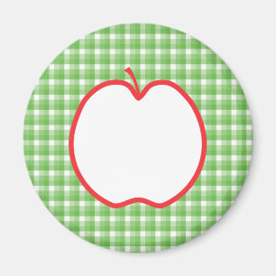 Röda Apple. Med grönt- och vitkontrollbakgrund Magnet