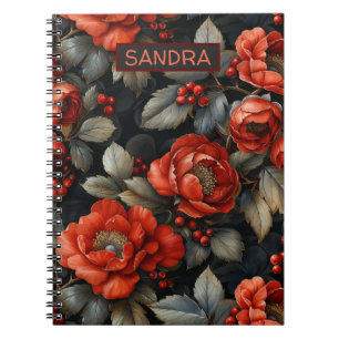 Röda blommor på svart anteckningsbok