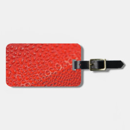 Röda droppar på glas bagagebricka