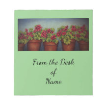 Röda Geraniumer i lerbalar