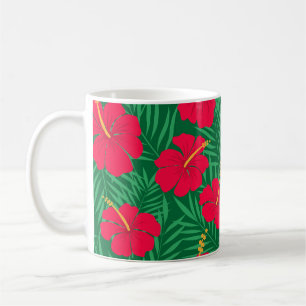 Röda hibiskusblommor på gröna tropiska blad  kaffemugg