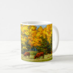 Röda kor under den gula nedgångträdmuggen kaffemugg