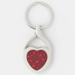 Röda kryddhjärtan twisted heart silverfärgad nyckelring