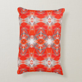 Röda kurvformar som flyter över vitt grått prydnadskudde