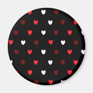 Röda och vithjärtor på svart magnet