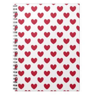 Röda polka-hjärtan på vitt anteckningsbok med spiral