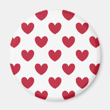 Röda polka-hjärtan på vitt