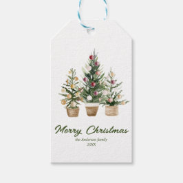 Röda prydnadsämnen i vattenfärgen Träd God jul Presentetikett