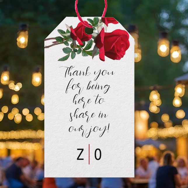 Röda rosor tack meddelande band på presentkort presentetikett (Skapare uppladdad)