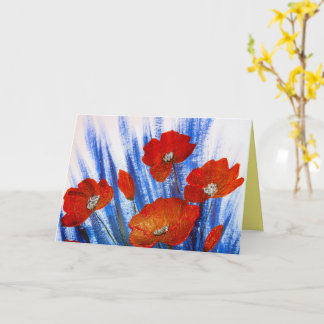 Röda vallmo i blågräs kort