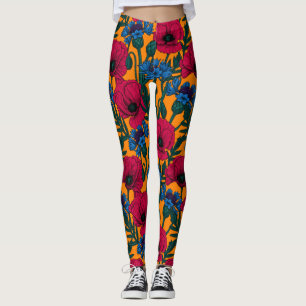 Röda vallmo och blåkornblommor på orangen leggings