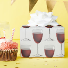 röda vin-glas på grått presentpapper