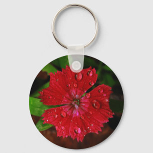 Rödblomma med röda dianthus med regndroppsfoto nyckelring
