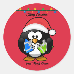 Rödbottenpenguin som håller Julklapp Runt Klistermärke