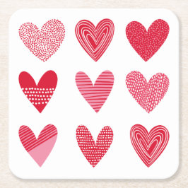 Rödhjärtan och rosa underlägg papper kvadrat