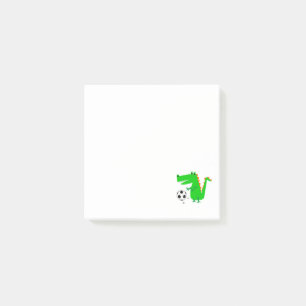 Rolig alligator som leker fotbolltecknaden post-it block