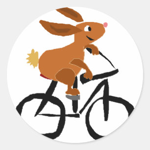 Rolig brun kaninridningcykel runt klistermärke