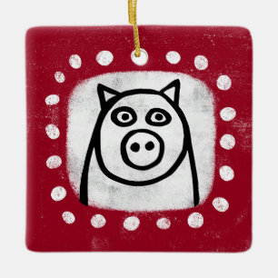 Rolig gris på röd ornament