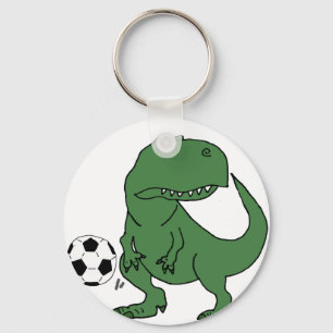 Rolig grön T-rex Dinosaur som leker fotboll Nyckelring