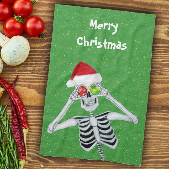 Rolig julskrattande skelettprydnad med ögon på grö kökshandduk (Fun Christmas skeleton ornament eyes Santa hat on green with gold flecks kitchen hand towel.)