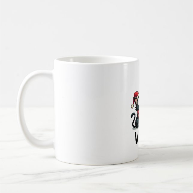 Rolig svart katt present som knuffar omkull julgra kaffemugg (Vänster)