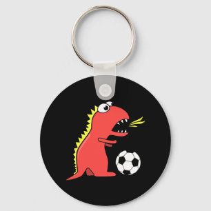 Rolig tecknadDinosaur som leker fotbollsvart Nyckelring