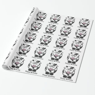 Rolig tecknadko med rosa näsgrattis på presentpapper