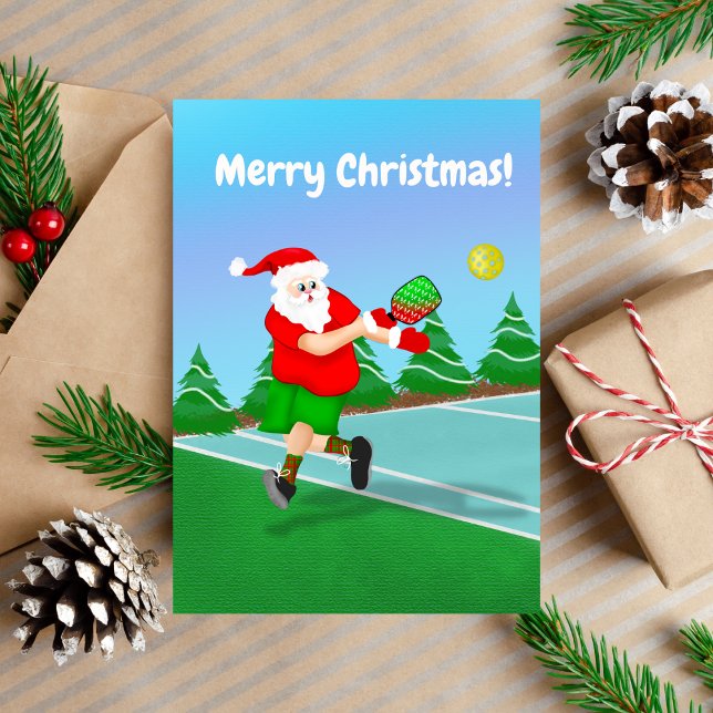 Rolig tomte som spelar Pickleball God Jul  Helgkort (Christmas Pickleball with Santa.)
