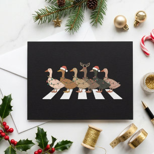 Roliga julankor som korsar Santa-hatt design Julkort