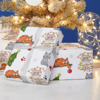 Roliga julkatten intrasslad i lampor Omslags Pappe Presentpapper