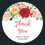 Romantic Roses Floral Wedding Thank You Runt Klistermärke<br><div class="desc">This beautiful and elegant wedding thank you sticker features watercolor red,  pink and orange roses with foliage. The text combines handwritten script and serif fonts for a stylish and modern look. This is perfect for a summer rustic wedding.</div>