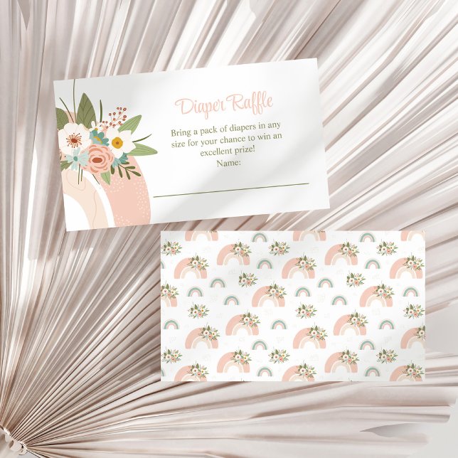 Rosa blommig regnbåge blöja lotteri inklusionskort tilläggskort (Pink Floral Rainbow Diaper Raffle Enclosure Card on a white dry palm leaf.)