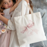 Rosa Bow Tote Bag Tygkasse<br><div class="desc">Lägg till lite elegans och feminitet i din vardag stil med den här chicen i väskan med en delikat rosa-båge och ett inledande monogram för personlig-skript. Den mjuka, gigantiska designen är perfekt för ett tillbehör till snyggten och lägger till en söt och trendig accent till alla enheter. Anpassa enkelt med...</div>