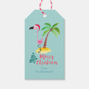 Rosa Flamingo i en Santa hatt vid en palmträd Presentetikett