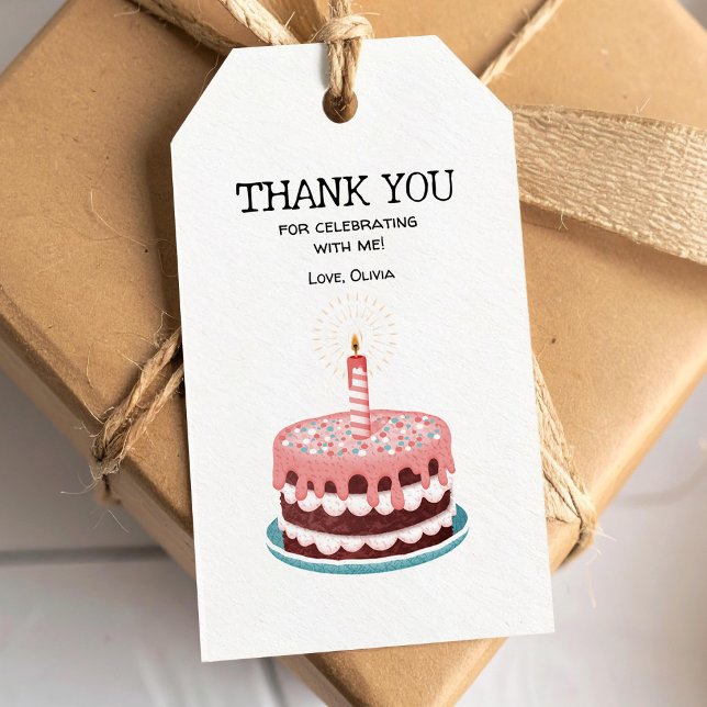 Rosa födelselsdagstårta med brinnande ljus presentetikett (Skapare uppladdad)