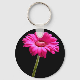 Rosa gerbera med hjärta på svart bakgrund nyckelring
