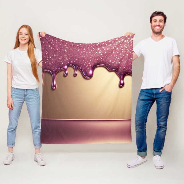 Rosa glitterdropp över guldmetallisk bakgrund fleecefilt (På plats)