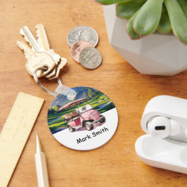 Rosa Golf Cart för kvinnlig golfer på grönt Nyckelring