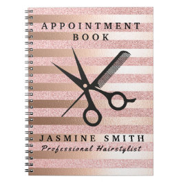 Rosa guld omkullkastar sax och anteckningsbok