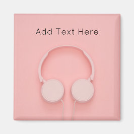 Rosa hörlurar med trådar magnet