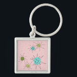 Rosa Iconic Atomic Starbursts Keychain Fyrkantig Silverfärgad Nyckelring<br><div class="desc">Den här Rosa Iconic Atomic Starbursts Keychain mönster har ikoniska atomstjärnor. Det är höger! Bakgrunden till färgaden old school, första Dam Rosa med guld-spektrum är perfektens bakgrund för färgaden av pulserande turkos, soothing celery och kitschy pear grönt circles. Sportarna i färg placeras sporadiskt i olika storlekar med överliggande V-formad linjer...</div>